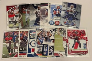 lot 122B image: (13) Tom Brady Football Card Lot
