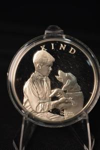 lot 15 image: Norman Rockwell Boy Scouts 1oz Sterling Silver Coin