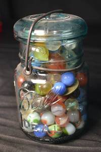 lot 66 image: Ball Mason Jar - Aqua Glass with Colorful Marbles Inside, Bail Closure
