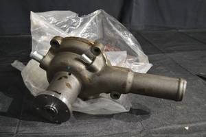 lot 224 image: Engine Water Pump Housing - Cast Metal, Four-Bolt Flange, InletOutlet Tube