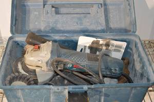 lot 272 image: Bosch Angle Grinder 4-12 in - With Assorted Grinding Discs in Blue Case
