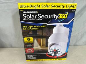 lot 148 image: New Solar Security 360 Motion Activated Spotlight - Looks like Camera