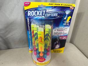 lot 214 image: New Rocket Copters Soaring LED Helicopters