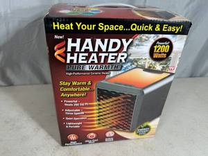 lot 293 image: New Handy Heater Pure Warmth Ceramic Space Heater with LED Lights