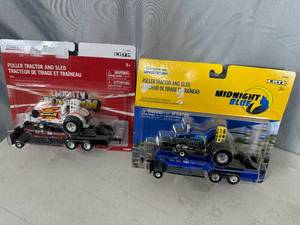 lot 36 image: New Case and New Holland Tractor Pulling Tractors and Weight Sled Toy Sets