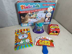 lot 64 image: New Pixicade Game Maker, Slinky, Kinetic Sand, and Other Toys