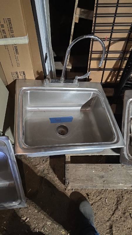 lot 10011 image: Stainless steel sink with faucet