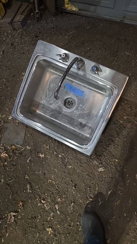 lot 11012 image: Stainless steel sink with faucet