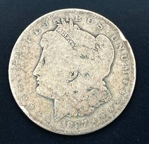 lot 52 image: 1887-O Morgan Silver Dollar