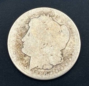 lot 104 image: 1886-O Morgan Silver Dollar