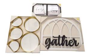 lot 71 image: Home decor set with a sleek circular mirror, a gather sign, and small signs that say family and happy place.