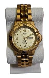 lot 49 image: 1990s Reliance by Croton Model 34TM , Gold and Day and Date