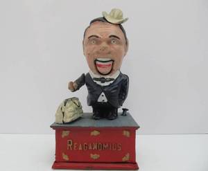 lot 94 image: Antique Style Cast Iron Mechanical Bank #3 - Reaganomics