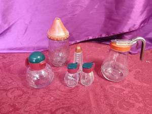 lot 58 image: 1 Vintage syrup pitcher, vintage S&P shakers, vintage sugar shaker,