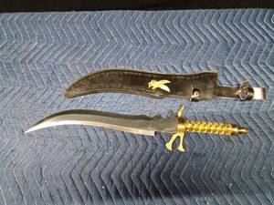 lot 69 image: Ornate Ambian Scimitar sword with eagle sheath and gold twisted handle