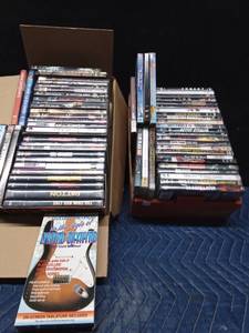 lot 81 image: 2 Boxes of DVDs and 1 VHS (Guitar Method in the Style of Lynyrd Skynyrd)