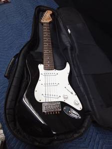 lot 87 image: Squier mini fender electric guitar with strap and soft case - Works