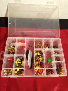 lot 135 image: Plastic Plano tackle box of fishing jigs, hooks, spoon, sinkers and more