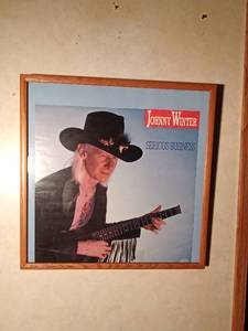 lot 150 image: Framed poster of Johnny Winter