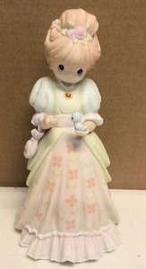 lot 118 image: Precious Moments Figurine Charity Begins in the Heart Item#307009
