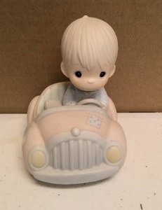 lot 142 image: Precious Moments Figurine Im following Jesus item#PM-862