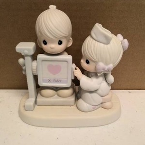 lot 259 image: Precious Moments Figurine My Heart is Exposed with Love Item#520624