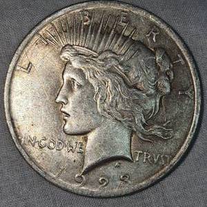 lot 24 image: 1923 Peace Dollar $1  wToning