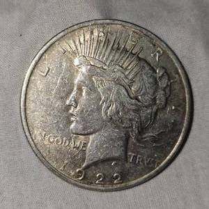 lot 20 image: 1922 Peace Dollar $1 VF  Plus wToning