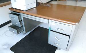 lot 56 image: by Rm 204 -  steel desk and floor mat