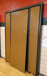 lot 63 image: Rm 202 - murphy bed style cafeteria tables 7 ft x 30 in tables folds out to 14 ft - brown