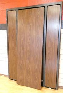 lot 64 image: Rm 202 - murphy bed style cafeteria tables 7 ft x 30 in tables folds out to 14 ft - walnut