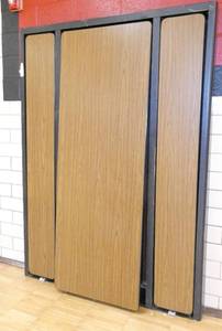 lot 65 image: Rm 202 - murphy bed style cafeteria tables 7 ft x 30 in tables folds out to 14 ft - brown