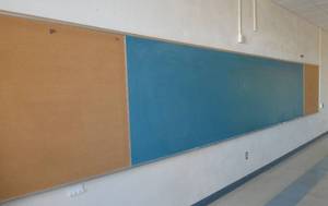 lot 76 image: Rm 211 - Huge 12ft chalk board with 6 ft cork boards on each end  12 ft Cork board with a 6 ft chalkboard on one end
