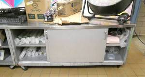 lot 99 image: K - steel storage cabinet on wheels, stainless top