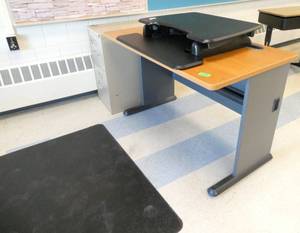lot 179 image: Rm 217 - Desk with computer riser, file cabinet, floor mat