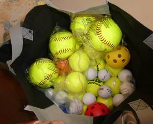 lot 248 image: GymO- bag full of new baseballs, tennis balls, golf balls