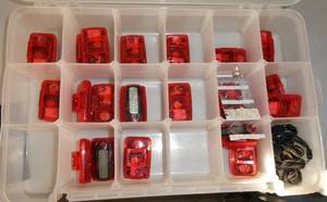 lot 249 image: GymO- Container of new pedometers and batteries and table