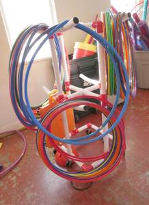 lot 263 image: GymS- Stand full of hula hoops