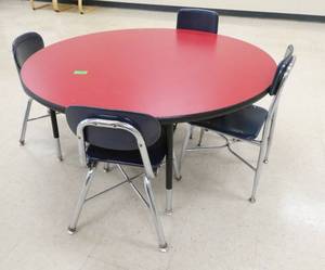 lot 303 image: Rm 114 - Red 4ft table with 4 blue chairs