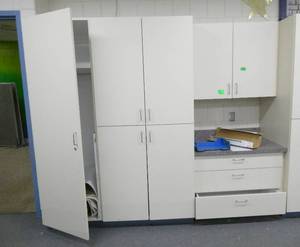 lot 321 image: Rm 114B - cabinetry, coat closet, regular cabinet, drawers with upper cabinet