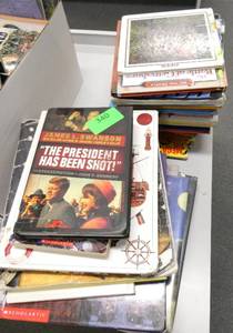 lot 340 image: Rm 114B - 3 piles of books and a 3 shelf organizer with crayons