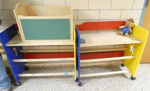 lot 391 image: by Rm 110 - 2 portable storage units, a toy box, 3 chairs and a desk