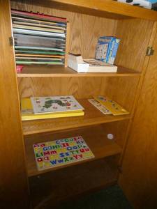 lot 395 image: Rm 101A - solid wood storage cabinet 18d 50h with contents and 2nd empty cabinet
