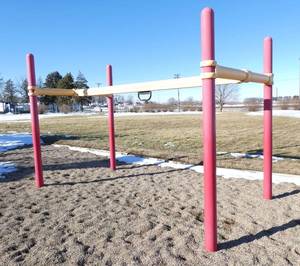 lot 127 image: Outside - Ninja bar - the bar moves left and right and the ring you hang onto travels the length of the bar