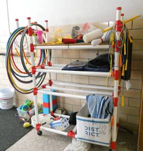 lot 434C image: by Rm 108 - PVC rack with misc sporting goods