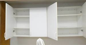 lot 434 image: Rm 108 - cabinets on the wall