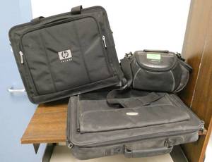 lot 499 image: Rm 102 - 2 laptop bags and a camera bag