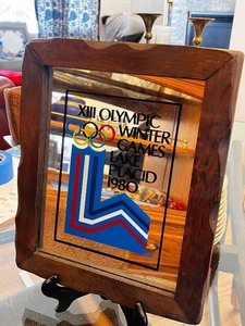 lot 47 image: 1980 Lake Placid Olympic Winter Games Framed Glass Art and Coca-Cola Pin