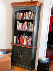 lot 62 image: Green Corner Bookshelf with Wood Trim and Cabinet Doors