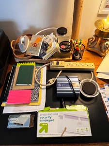 lot 77 image: Office Supply Collection with Power Inverter, Power Strip, Notebooks, Envelopes, and Accessories